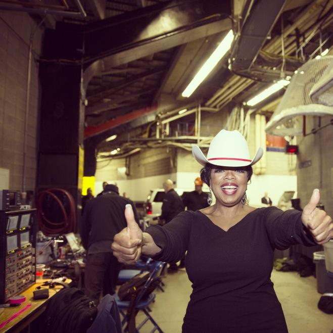 oprah white hatted in calgary cowboy hat